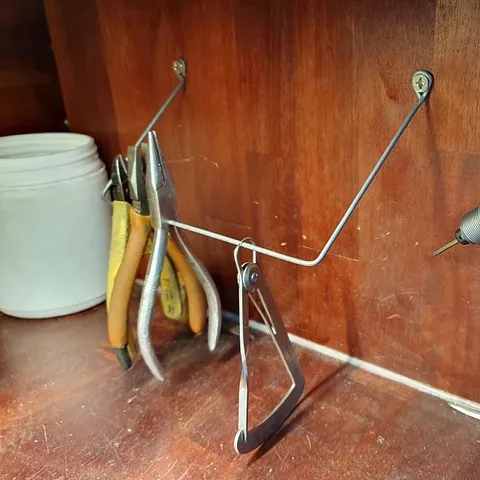 Here is a great way to turn a wire hanger into storage for your pliers and tweezers from @refraction_manufacturing -...