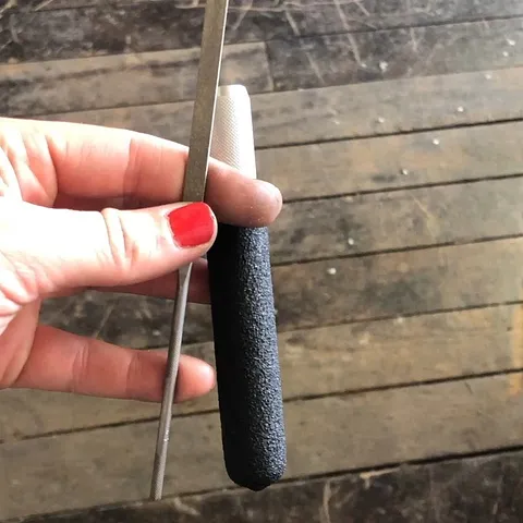 Here's an inexpensive solution for making your needle files comfortable to hold without investing in a variety of handles....