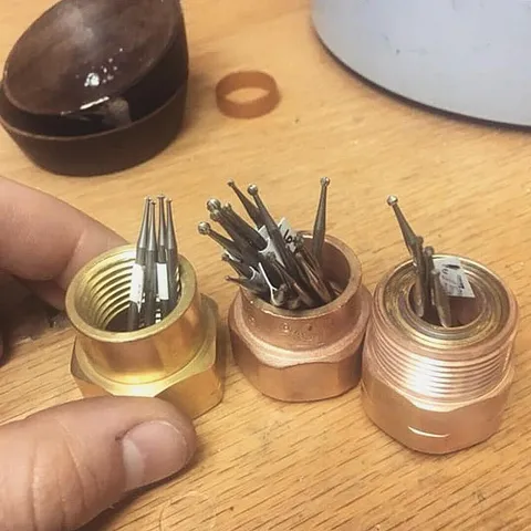 I love this bur storage solution from @piecesofstarrjewelry - “1/2 inch brass pipe ends and coupling (purchased from Home...