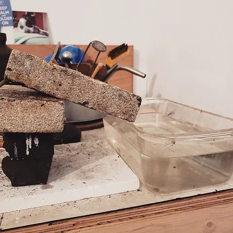 When you are creating balls - angle your brick into a container of water and as you form the balls they will roll off the...