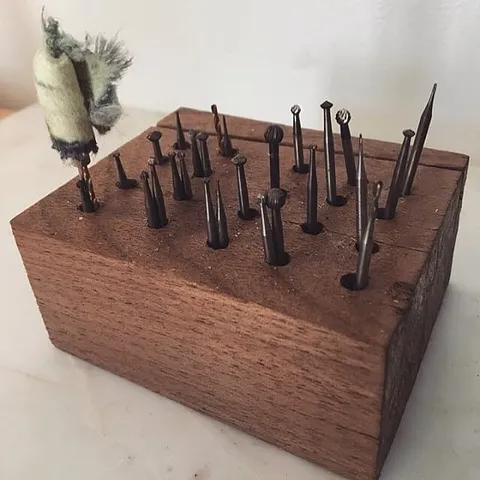 Here is a simple solution for storing drill bits and burs from @monicasquitieri just take a block of wood and drill holes!...