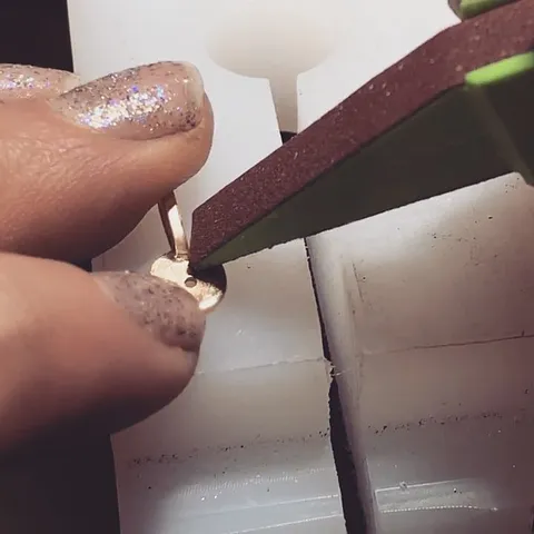 Here is a technique for cleaning up excess solder around a tight space (like this bail) I used this amazing sanding stick...