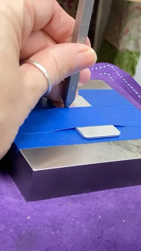 Love this tip of using painter’s tape to not only secure your metal but also help align those letter stamps from...