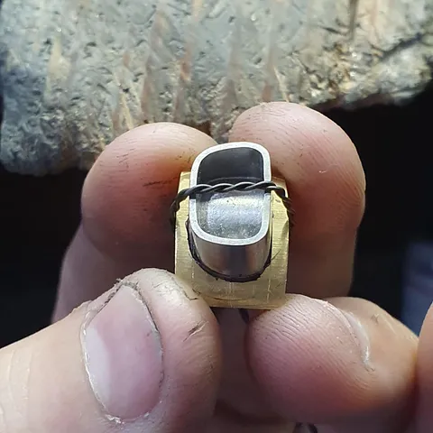 Here is a tip for soldering a bezel to a baseplate from @refraction_manufacturing - “I use binding wire to hold the...