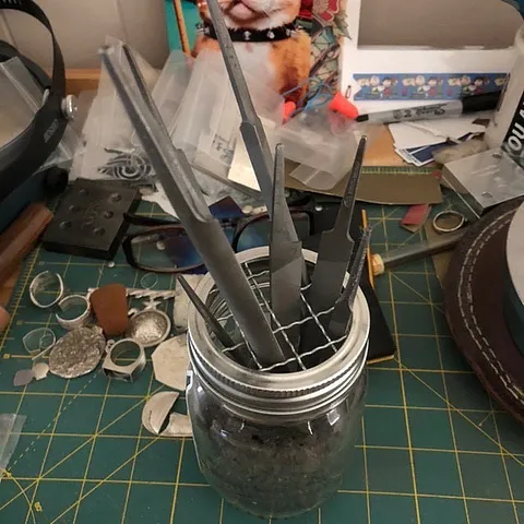 Here is a tip for storing files from @nikkicav27 - “This is how I store my files so they don’t rub...small mason jar foam...