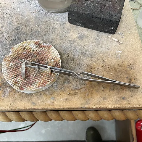 Here is a tip for holding your work while you solder, if you have a Ceramic Honeycomb Board with pins (I highly recommend)...
