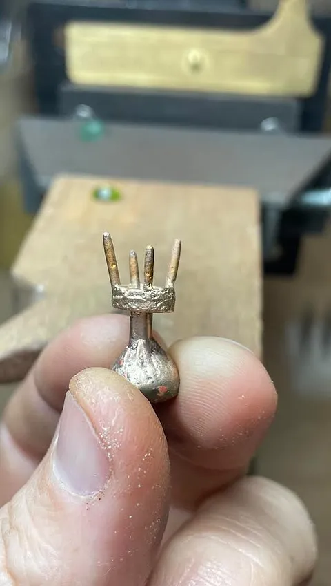 Here is an awesome sand casting tutorial including a nifty knitting-needle technique for creating prongs directly in Delft...