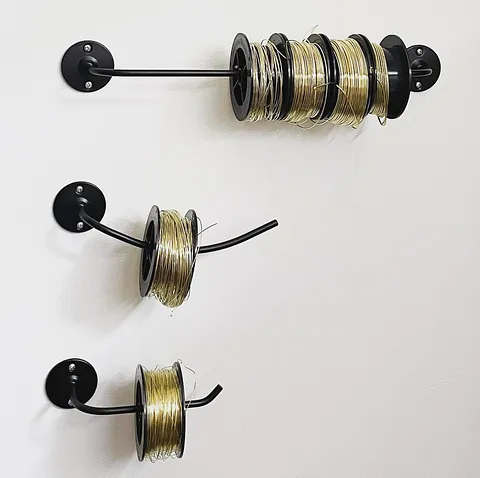 Here is a wire storage tip from @rebeccaholt02 - “I use a lot of brass spools in my work and I found this set of bathroom...