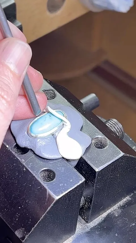 In this quick clip I’m using a modified nail to gently hammer set a thick (1mm) silver bezel around a piece of turquoise....
