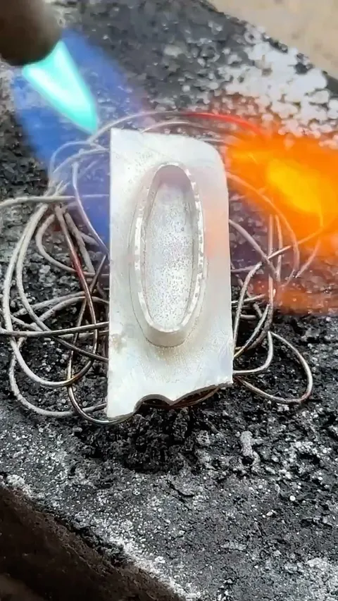 Create a soldering nest like this by taking 22g/.64mm (it can be heavier or thinner as well) bending and flattening it....