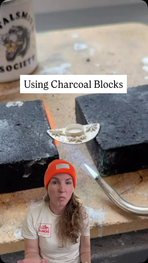 Two charcoal blocks = a simple way to get heat underneath your work. 🔥

I’m soldering a thin bezel onto a large back plate...